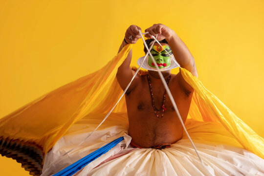 Kathakali dancer getting ready for his performance. 
