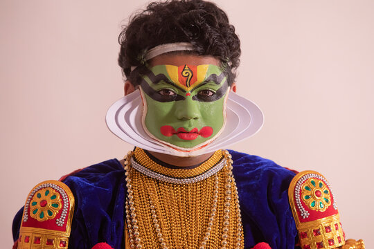 Kathakali dancer in front of white background after getting ready. 