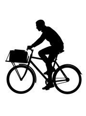 Obraz premium Silhouette of a person riding a delivery bicycle