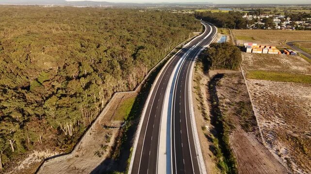 Aerial drone view of the M1 Pacific Motorway Extension project at Heatherbrae, Newcastle, NSW Australia heading south toward Heatherbrae town centre on 26 July 2026
