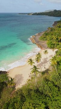 Deserted Playa Ermitano beach, Samana, Dominican Republic. Aerial drone, vertical format, copy space