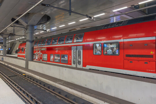 Berlin, Germany July 18, 2026. Red Double Decker Regional Train Parked at Berlin Hauptbahnhof Platform