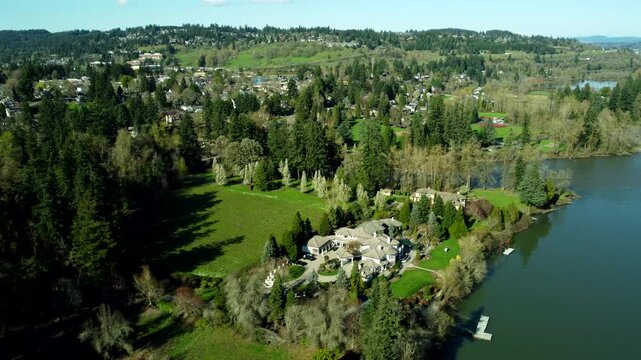 US, Oregon, West Linn, 2026-03-21 - Drone view of a mansion owned by an NBA player on the Wilamette River, in Summer