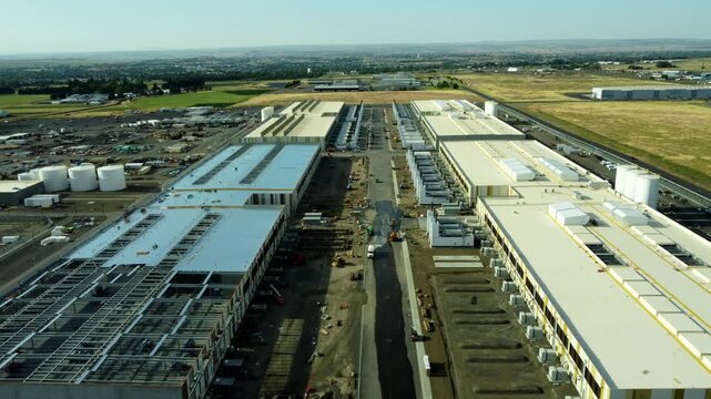 US, Oregon, Hermiston, 2026-05-27 - Drone view of an Amazon Data Center under construction serving AWS on us-west at the Penney Campus, in Summer