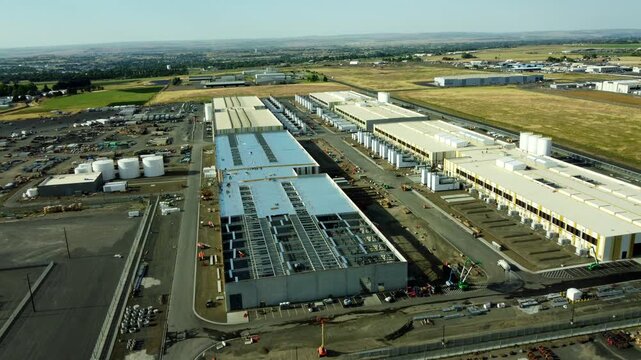 US, Oregon, Hermiston, 2026-05-27 - Drone view of an Amazon Data Center under construction serving AWS on us-west at the Penney Campus, in Summer