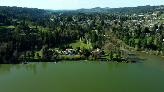 US, Oregon, West Linn, 2026-03-21 - Drone view of a mansion owned by an NBA player on the Wilamette River, in Summer