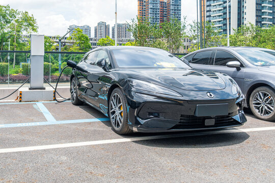 Shenzhen, China - May 22, 2026: Denza electric vehicle charging at public EV charging station in Shenzhen. Electric mobility, charging infrastructure, clean transportation, electric vehicle industry