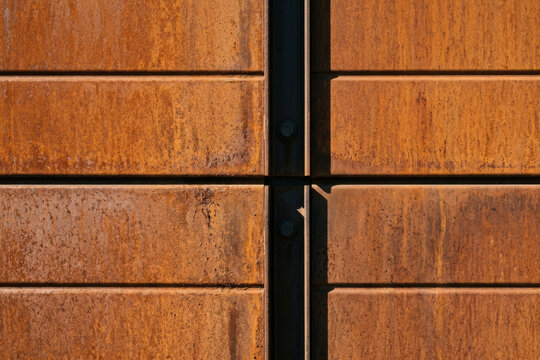 Rusty metal panels with industrial bolts