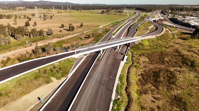 Low aerial drone view of Tarro Interchange on the M1 Pacific Motorway Extension project at Tarro, Newcastle, NSW Australia on 26 July 2026