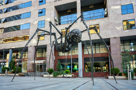 A steampunk-style spider sculpture located in the center in Aznavour square. Is a popular landmark in the city center, often cited in the context of contemporary art: Yerevan, Armenia - 26 July, 2026.