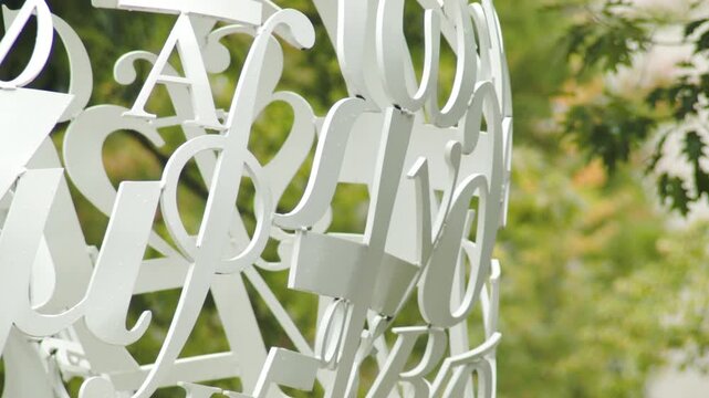 Close Up of White Metal Letter Sculpture Public Art Installation Outdoors, USA