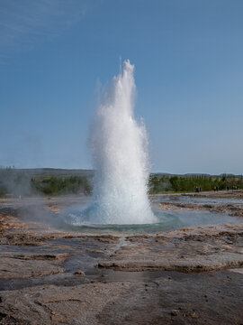 Strokkur Geyser Erupting in the Geothermal Area of Iceland
