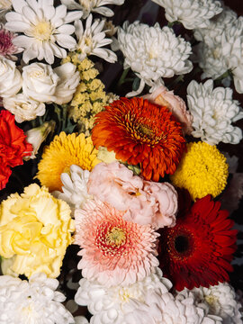 Bright mixed flower bouquet with roses, gerberas and chrysanthemums.