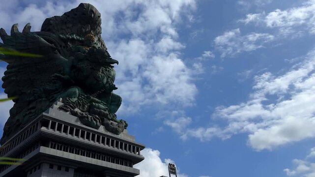 Bali, Indonesia - July 10, 2026: Garuda Wisnu Kencana statue rises at GWK Cultural Park under blue sky, showcasing iconic Hindu landmark and popular cultural tourism destination.