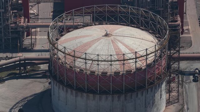 Aerial view of industrial gasometer tank inflating