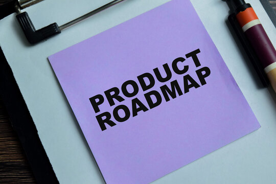 Concept of product roadmap write on sticky notes isolated on Wooden Table.