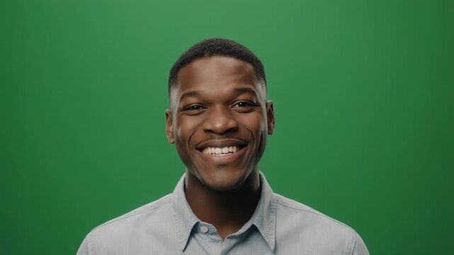 Man's diverse facial expressions during green screen filming conveying emotions like joy surprise and contemplation