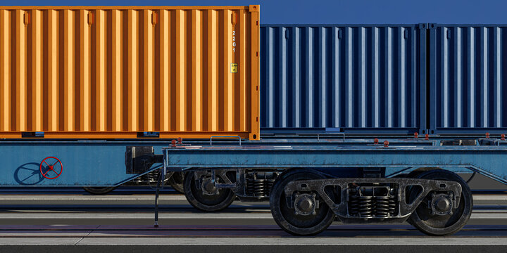 Side profile of orange shipping container on intermodal rail wagon