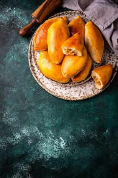 Traditional baked pies pirozhki with meat.