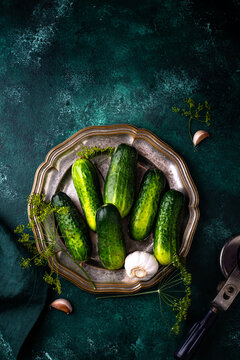 Preparation of marinated salty pickled cucumbers