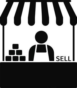 Businessman selling tickets at counter with service bell