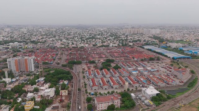 Koyambedu covered market spans in a grid pattern beside railway tracks.