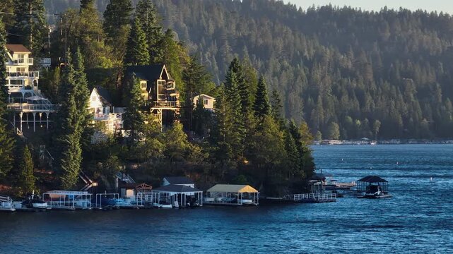 Telephoto aerial luxury waterfront houses and docks in the hills of Lake Arrowhead