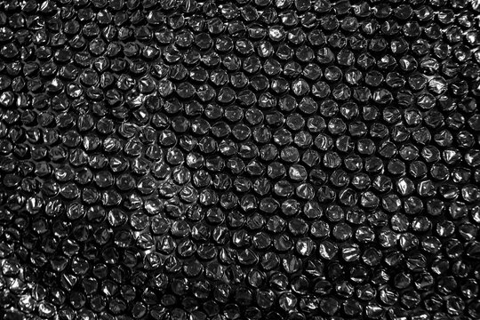 High Resolution Plastic Bubble Wrap Texture. black plastic buble wrap background