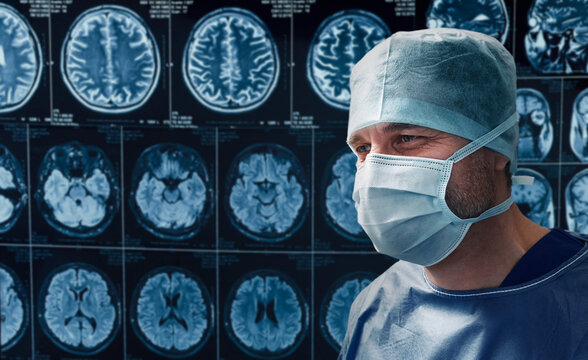 Experienced neurosurgeon examining patient's head MRI scans before brain surgery. Neurology and cerebral diagnostics in clinic.