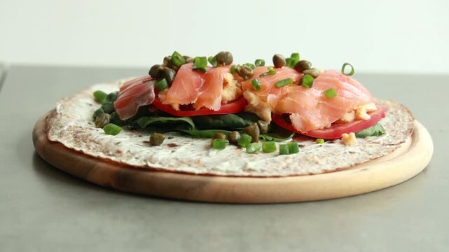Delicious Open Face Smoked Salmon and Egg Breakfast Wrap Served for Healthy Brunch 4K Video