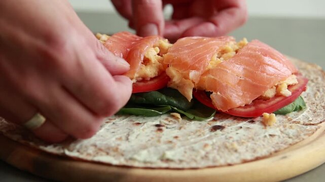 Delicious Open Face Smoked Salmon and Egg Breakfast Wrap Served for Healthy Brunch 4K Video
