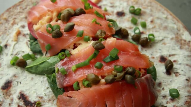 Delicious Open Face Smoked Salmon and Egg Breakfast Wrap Served for Healthy Brunch 4K Video