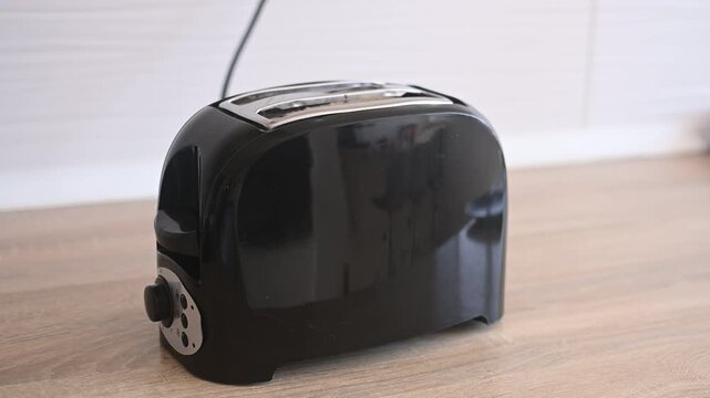 Preparing toast for breakfast in the kitchen