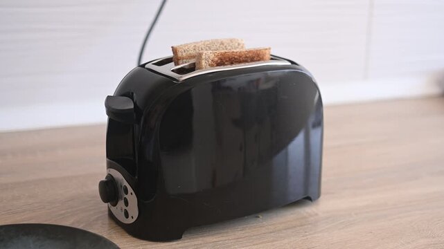 Preparing toast for breakfast in the kitchen