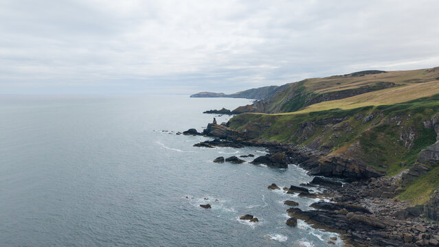 Panoramic landscape of the rugged Scottish coastline and cliff edges around Fast Castle in Berwickshire, Scotland