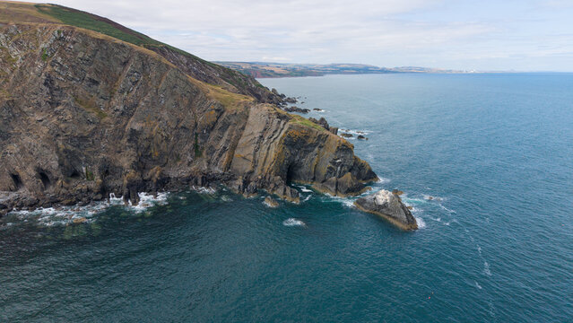 Aerial view of the rugged coastal cliffs and Fast Castle headland on the Berwickshire coast, Scotland