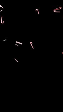 3D render animation of falling red and white Christmas candy canes on transparent background overlay for holiday 4k video loop