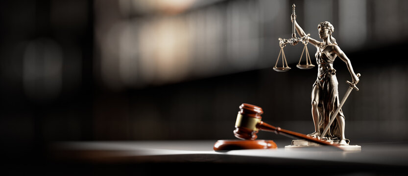 Lady Justice Statue and Judge Gavel on Desk Symbolizing Law, Legal System and Courtroom Justice