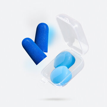 Foam earplugs and reusable silicone earplugs with storage case floating on light background. Concept of noise reduction, hearing protection and product choice for sleep, work and noisy environments