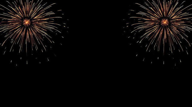 Golden fireworks burst against black sky creating festive symmetrical display