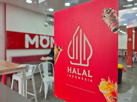 ​Indonesian Halal Logo Sign on Red Poster Board in Ice Cream Store Interior