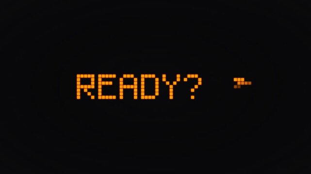 Retro style computer display sequence showing pixelated ready prompt and loading block animation.