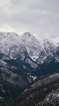 Aerial view on a fabulous snow-covered mountain peak. Zakopane, Poland
