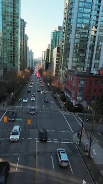 Flight between skyscrapers along the street in Downtown of Vancouver
