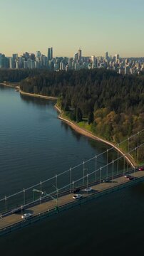 Aerial view of Lions Gate Bridge and Stanley Park at dawn. Canada