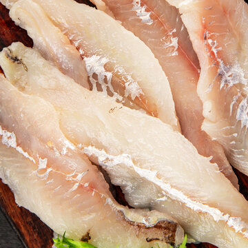 Whiting fish raw fillet fresh seafood  pescetarian diet tasty snack fresh delicious gourmet food background on the table rustic food top view copy space