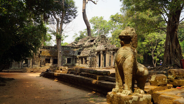 Ancient stone temple ruins with a traditional guardian lion statue in front