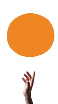 Hand bouncing orange circular placeholder for branding and graphic animation. Concept of stop motion marketing, logo presentation, visual identity, creative advertising, and commercial design.