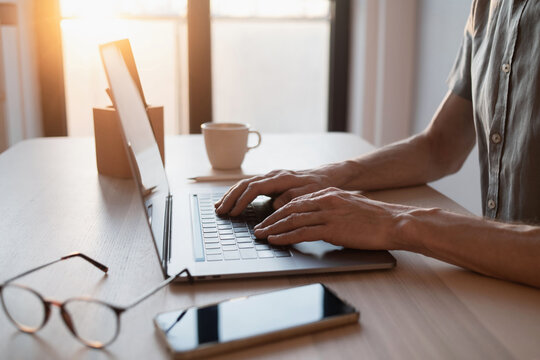 Man hands typing on computer keyboard closeup, businessman or student using laptop at office, online learning, internet marketing, working from home, office workplace freelance concept