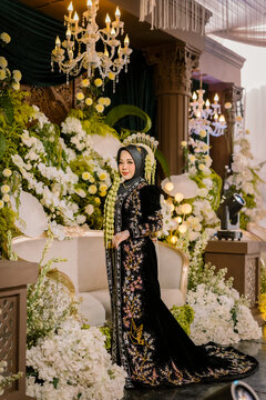 Portrait of Javanese Solo Putri Bride in Black and Gold Traditional Attire